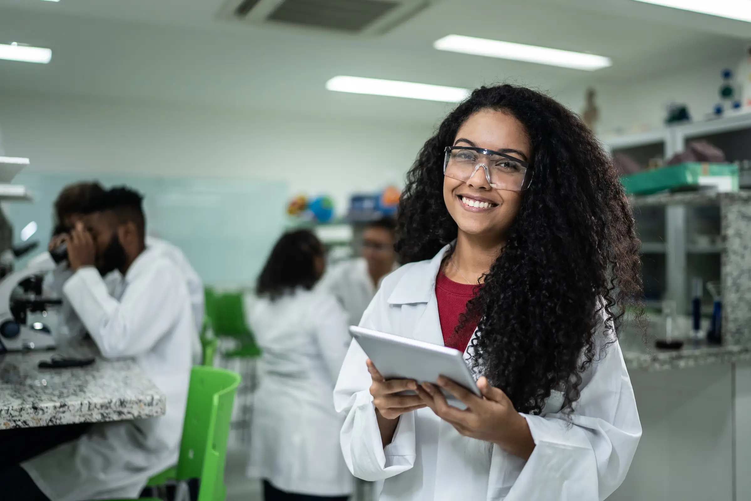 Portrait of a happy student in the lab